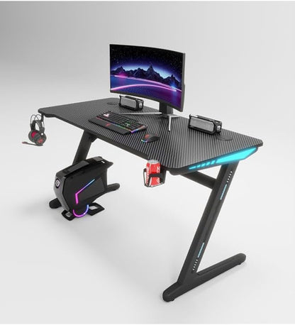 Gaming desk with monitor, keyboard, and mouse on a white background