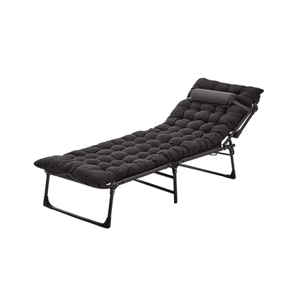 Black folding bed with quilted mattress on a white background
