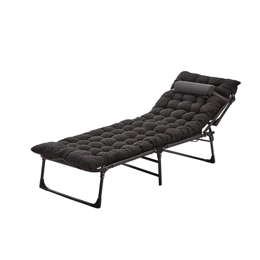 Black folding bed with quilted mattress on a white background